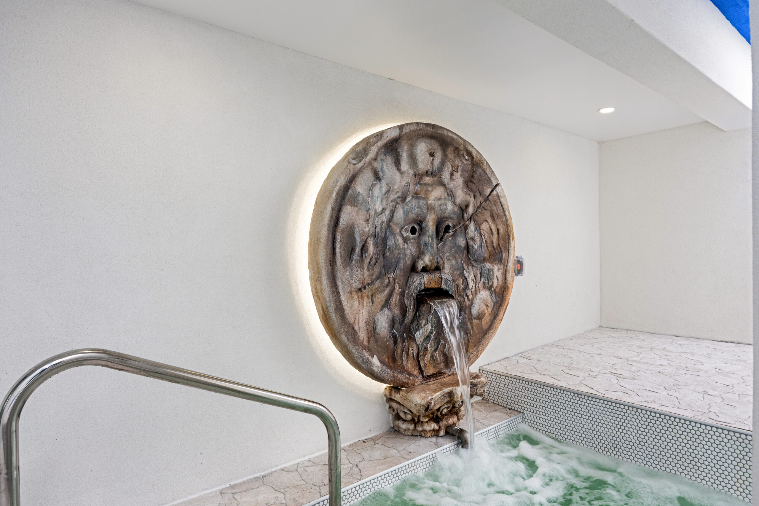 new pool amenity in the outdoor pool area, featuring depiction of Poseidon