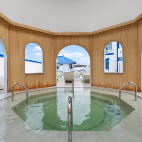 inside of hot tub area, facing the seated medi spa pool