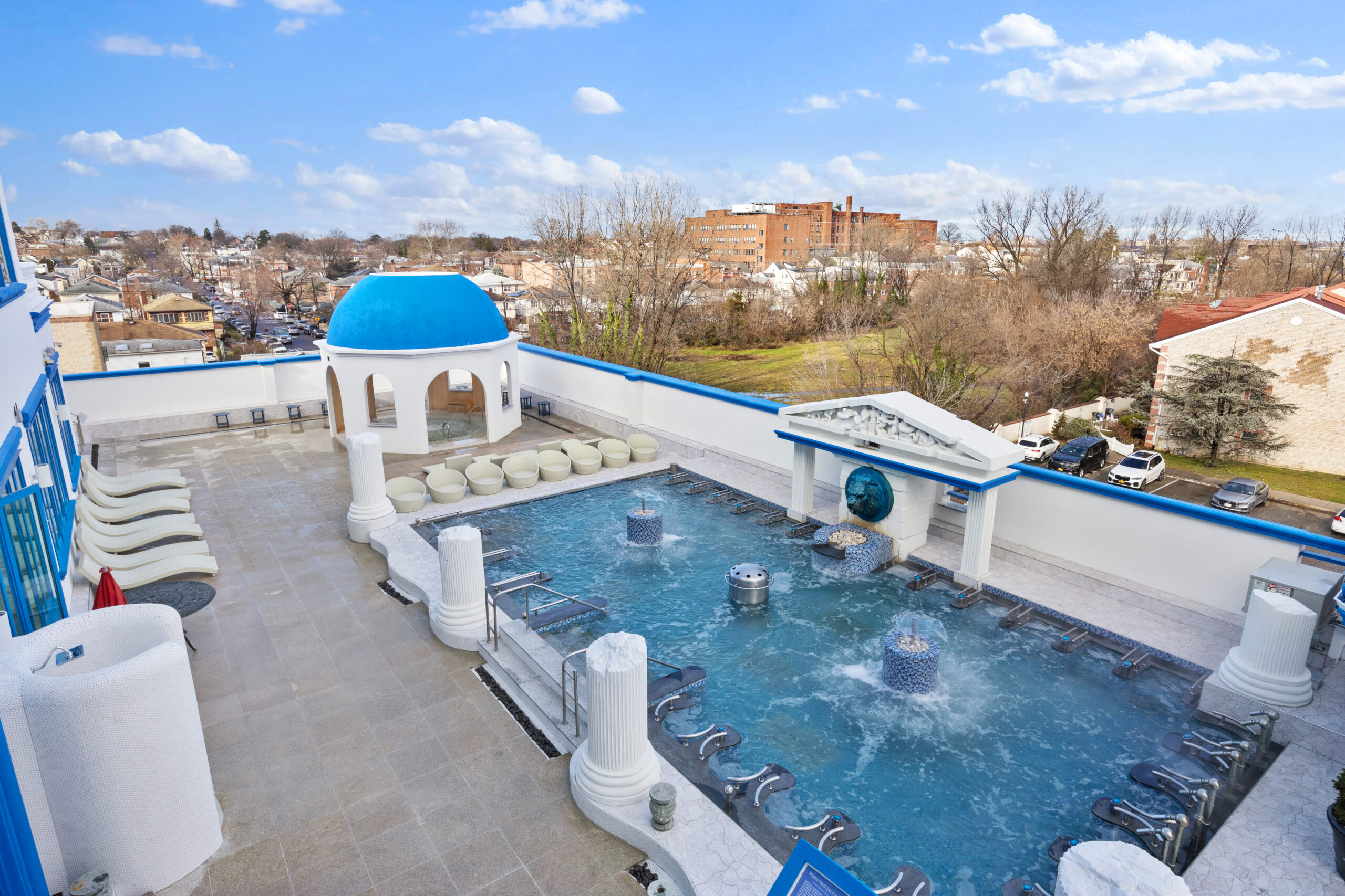 Elevated shot of Spa Castle's outdoor pool area, focusing on the outdoor hot tube and Seated Medi Spa Pools