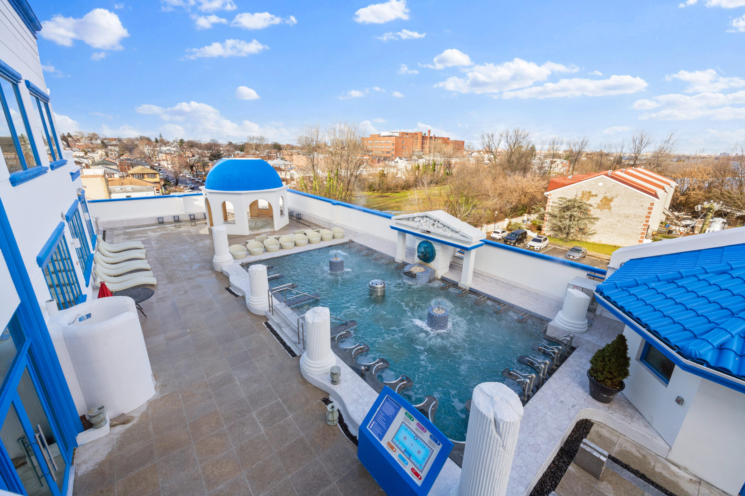 Elevated shot of Spa Castle's outdoor pool area, focusing on the outdoor hot tube and Seated Medi Spa Pools