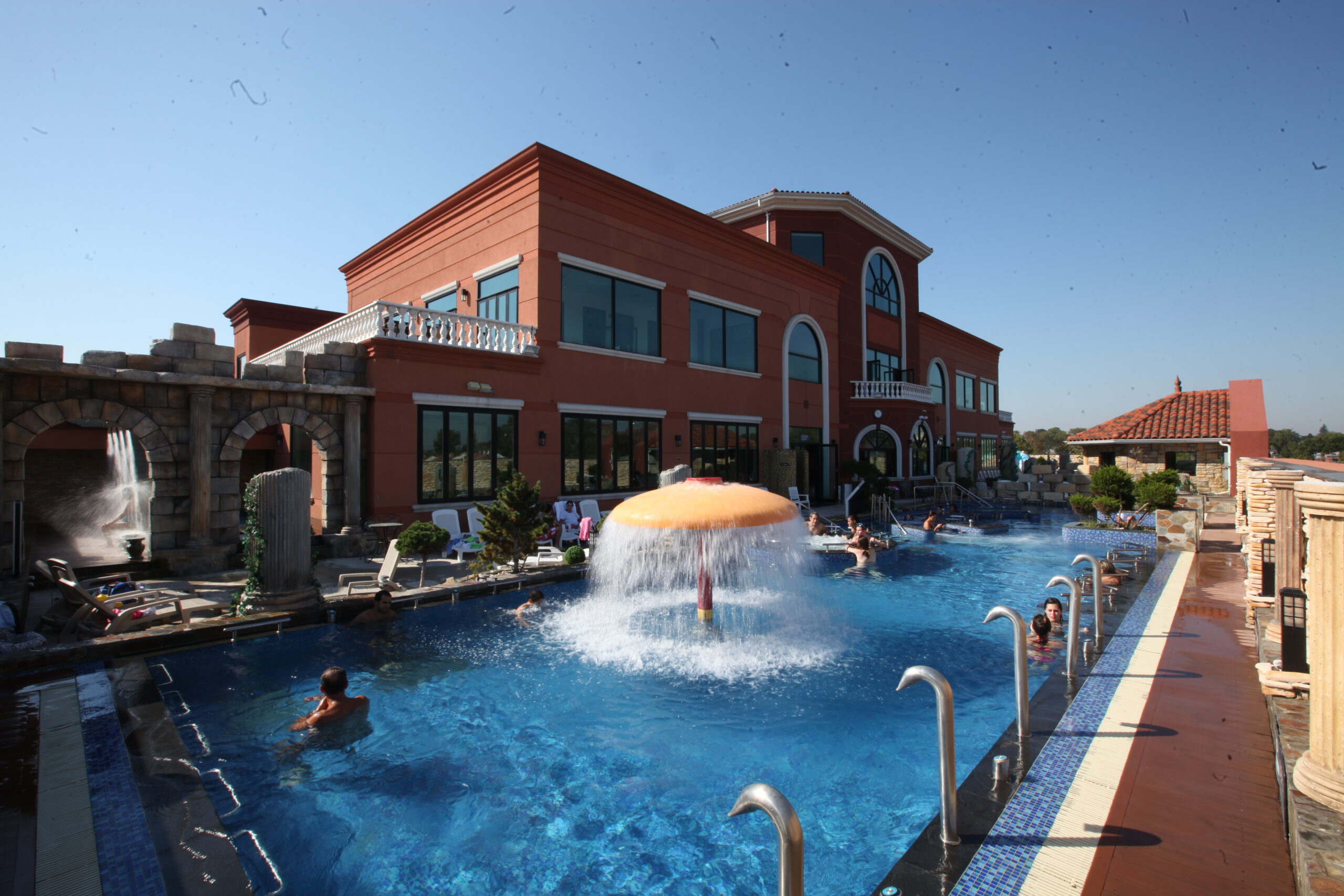 Old photo of the outdoor pool side area before renovations